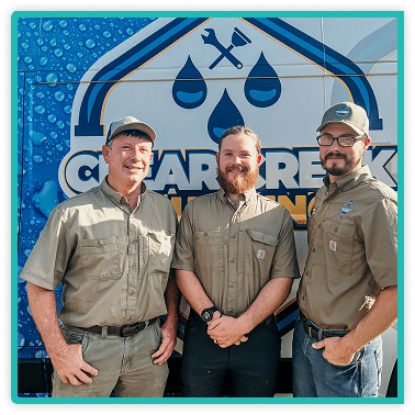 owners standing in front of company van smiling