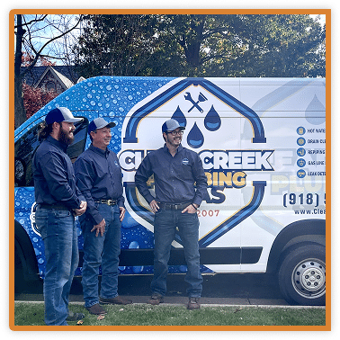 owners standing in front of company van