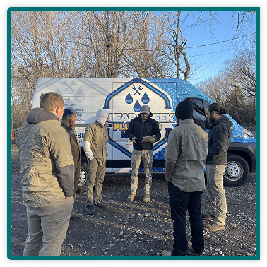 workers talking in front of company van